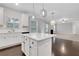 Kitchen island featuring stainless steel sink and appliances, plus backyard access at 3808 The Great Dr, Atlanta, GA 30349