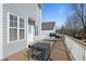 A wooden deck with outdoor seating, perfect for relaxation or gatherings at 4085 Amberly Nw Grn, Kennesaw, GA 30144