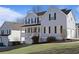 Two story home featuring well maintained lawn and three car garage at 4085 Amberly Nw Grn, Kennesaw, GA 30144