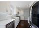 Modern kitchen features white cabinets, stainless steel appliances, white subway tile, and hardwood floors at 4085 Amberly Nw Grn, Kennesaw, GA 30144