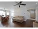 Open-concept living area featuring hardwood floors and neutral-toned furniture at 4085 Amberly Nw Grn, Kennesaw, GA 30144