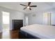 Bright main bedroom features hardwood floors, a ceiling fan, and a large closet at 4085 Amberly Nw Grn, Kennesaw, GA 30144