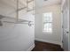 Walk-in closet has metal shelving and hanging rod at 4085 Amberly Nw Grn, Kennesaw, GA 30144