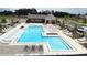 Community pool and amenity area, including a pavilion, seating, and multiple pool areas for relaxation and recreation at 704 Dodd Ln # 158, Buford, GA 30518