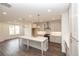 Spacious kitchen with a large island, stainless hood and a window at 704 Dodd Ln # 158, Buford, GA 30518
