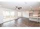 Living room with gray walls, dark floors, and view of deck and kitchen at 704 Dodd Ln # 158, Buford, GA 30518