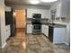 Bright kitchen with white cabinets, stainless steel appliances, and granite countertops at 1593 Woodmore Dr, Marietta, GA 30008