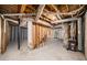 Unfinished basement features concrete floors, exposed duct work and stairs at 846 Brandy Oaks Ln, Stone Mountain, GA 30088