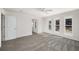 A sunlit bedroom with plush carpet, neutral walls, and multiple windows at 846 Brandy Oaks Ln, Stone Mountain, GA 30088