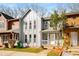 Charming townhome featuring a gray facade, front porch, and large windows at 846 Brandy Oaks Ln, Stone Mountain, GA 30088