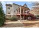 Spacious backyard featuring a two story deck with covered patio and outdoor seating at 6304 Long Island Drive, Sandy Springs, GA 30328