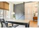 Bright office space featuring a sliding barn door, desk, and natural light from a window at 6304 Long Island Drive, Sandy Springs, GA 30328