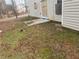 Backyard with door and windows boarded up with scattered glass at 6357 Polar Fox Ct, Riverdale, GA 30296