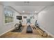 Home gym with natural light, exercise equipment, and neutral decor at 2867 Dresden Way, Atlanta, GA 30341