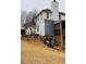 View of the home's backyard featuring a two-story deck and ladder at 3008 Stockbridge Way, Dacula, GA 30019