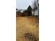 Wide shot of the backyard highlighting the stone walkway and wooden fence at 3008 Stockbridge Way, Dacula, GA 30019