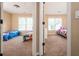 Shared bedroom with a connecting door showcases two twin beds and natural light from the windows at 3008 Stockbridge Way, Dacula, GA 30019