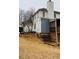 Rear exterior view of a home showing the deck and yard with ample natural light at 3008 Stockbridge Way, Dacula, GA 30019