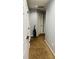 Carpeted hallway with white doors and a vacuum at 3008 Stockbridge Way, Dacula, GA 30019