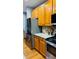 Well-equipped kitchen with stainless steel appliances, granite countertops, and wooden cabinets at 3008 Stockbridge Way, Dacula, GA 30019