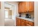 Inviting kitchen area featuring granite counters, cabinetry, and a view into an adjacent room at 3008 Stockbridge Way, Dacula, GA 30019