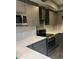 Updated kitchen with gray cabinets, stainless steel appliances, white countertops, and stylish backsplash at 3008 Stockbridge Way, Dacula, GA 30019