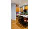 Stylish kitchen with a center island, seating, stainless steel appliances, and hardwood floors at 3008 Stockbridge Way, Dacula, GA 30019