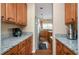 Beautiful kitchen with granite countertops, wooden cabinetry, and stainless steel appliances at 3008 Stockbridge Way, Dacula, GA 30019