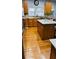 Spacious kitchen featuring a large island, granite countertops, wooden cabinets, and natural light at 3008 Stockbridge Way, Dacula, GA 30019