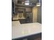 Kitchen with gray cabinets, white countertops, stainless steel refrigerator and appliances at 3008 Stockbridge Way, Dacula, GA 30019