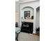 Cozy living room with a decorative fireplace and shelving at 3008 Stockbridge Way, Dacula, GA 30019