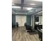 Salon area featuring professional styling chairs, wood-look tile flooring, and recessed lighting at 3008 Stockbridge Way, Dacula, GA 30019