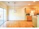 Eat in kitchen with light yellow walls and wood floors at 485 Lantern Wood Dr, Scottdale, GA 30079