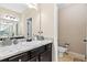 Bathroom with a mirror, vanity, and a toilet with tiled floors at 11181 Wind Ridge Dr, Hampton, GA 30228