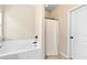 Bright bathroom featuring a shower and bathtub, tiled floors and granite vanity at 11181 Wind Ridge Dr, Hampton, GA 30228