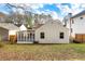 Spacious backyard featuring a screened porch, level ground, and mature trees, perfect for outdoor entertaining at 1612 Alder Se Ct, Atlanta, GA 30317