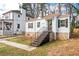 Home exterior with large front yard, stone foundation, siding, and covered entry at 1612 Alder Se Ct, Atlanta, GA 30317