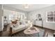 Inviting living room with neutral tones, modern decor, and ample natural light, perfect for relaxation and entertaining at 1612 Alder Se Ct, Atlanta, GA 30317