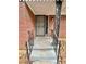 A cozy front porch with decorative railings welcomes you home at 1905 Fort Valley Sw Dr, Atlanta, GA 30311