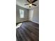 A well-lit room is painted light gray and is floored with new gray-brown vinyl plank flooring at 2322 Ewing Sw St, Atlanta, GA 30331