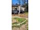 Recently renovated home with new landscaping including rock borders and lush vegetation at 2322 Ewing Sw St, Atlanta, GA 30331