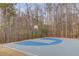 Community fenced basketball court with blue and gray surface and a basketball hoop at 243 Wedmore Ct, Suwanee, GA 30024