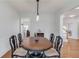 Open dining area with stylish lighting and space for entertaining at 243 Wedmore Ct, Suwanee, GA 30024