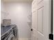 Laundry room with a newer washer and dryer and wire shelving for storage at 243 Wedmore Ct, Suwanee, GA 30024