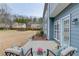 Outdoor patio with furniture and a view of the backyard and neighboring houses at 243 Wedmore Ct, Suwanee, GA 30024