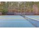 Close-up of community tennis court showcasing the net and the 'Grandview The Glen' banner at 243 Wedmore Ct, Suwanee, GA 30024