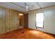 Bedroom with ceiling fan, window, and doorway at 559 Quail Trail Rd, Auburn, GA 30011