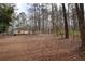 Single-story home featuring a traditional facade, multiple entry points and yard at 559 Quail Trail Rd, Auburn, GA 30011