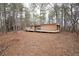 Exterior view of home surrounded by trees and natural landscape at 559 Quail Trail Rd, Auburn, GA 30011