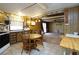 Kitchen and dining area featuring tile and carpet flooring at 559 Quail Trail Rd, Auburn, GA 30011